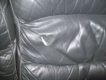 cracked and torn leather sofa