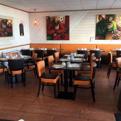 renovation of 44 chairs and 6 benches in imitation leather or leatherette in orange and brown colours for restaurants