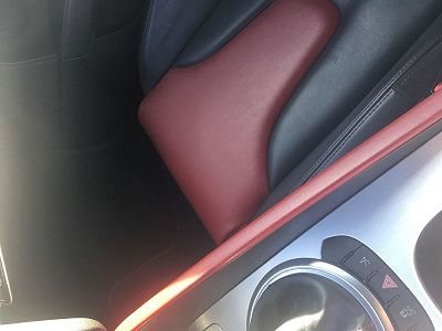 2010 audi tts seat with two-tone black and red leather interior.