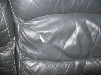 cracked and torn leather sofa