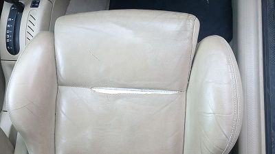 torn golf seat stitching