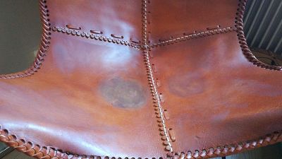 bleached/stained leather armchair