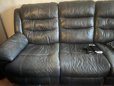 faded/worn black leather sofa