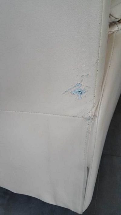 rénovation d'un canapé cinq places en skaï.