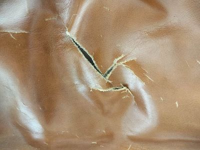 réparation grosse déchirure coussin assise fauteuil cuir