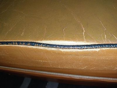 Déchirure fauteuil club